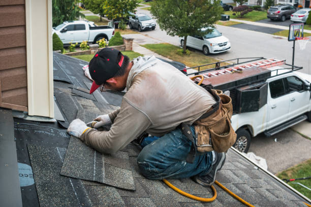 Professional Roofing technician working in Byfield, MA